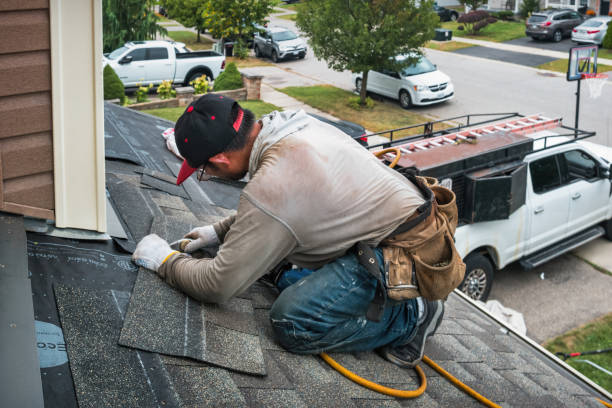Professional Roofing technician working in Evans, CO